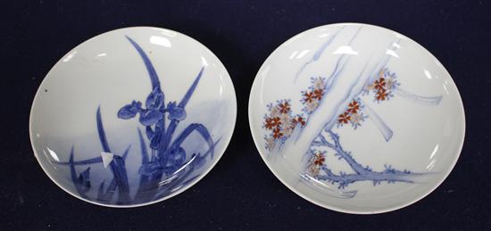 Two Japanese porcelain saucer dishes, decorated with irises and flowering trees, diameter 15.5cm